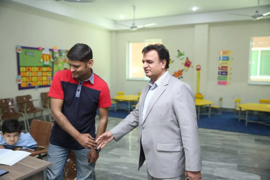 A guest being welcomed in a classroom