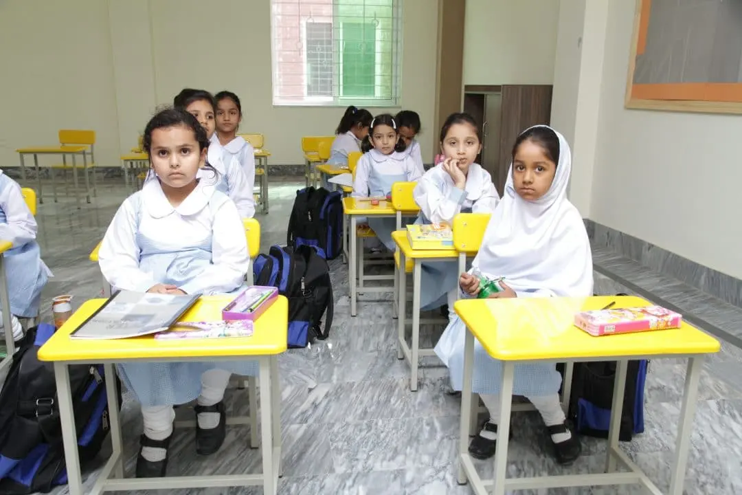 Girls working at their desks in class