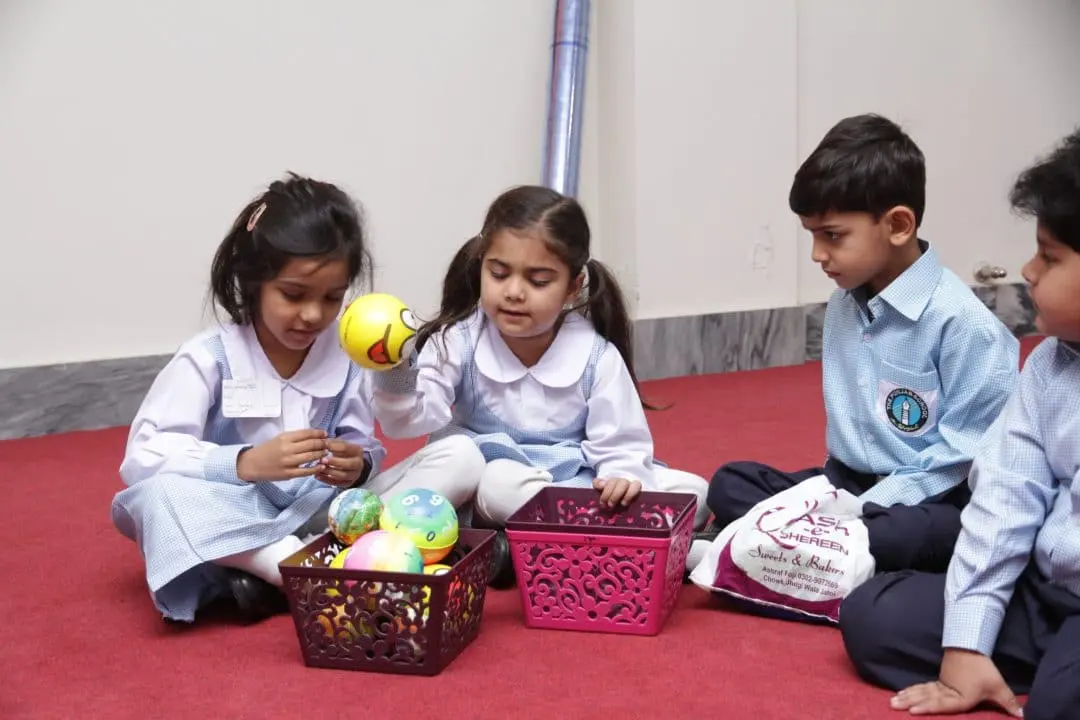 Children sitting on the carpet during an activity