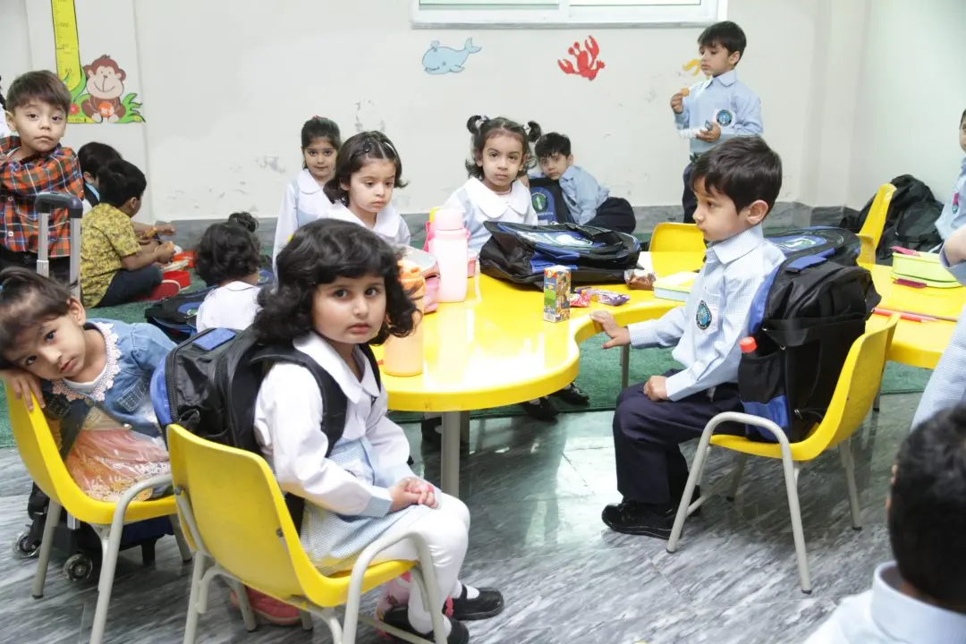 Nursery children at round tables